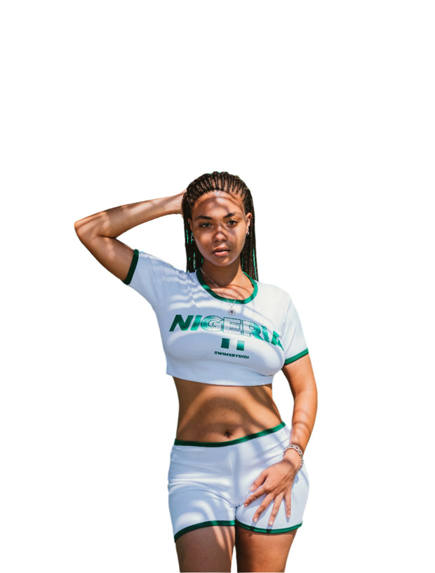 white Nigeria Crop Top for Women – Celebrate Nigerian culture in style with this size-inclusive, custom-made crop top. Ideal for casual outings and a perfect fit for any body typ