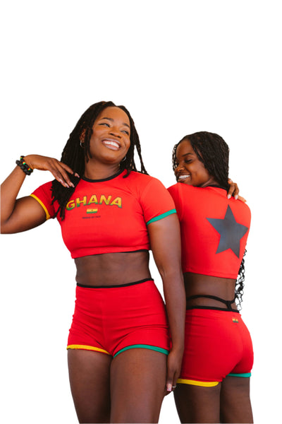 Vibrant red crop top and matching shorts set, inspired by Ghanaian culture, featuring bold patterns and colors that celebrate heritage and summer fashion.
