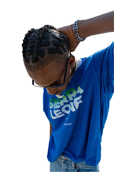 Sierra Leone-inspired T shirt with bold, vibrant colors and patterns, capturing the essence of West African culture and style in a modern, cropped design.
