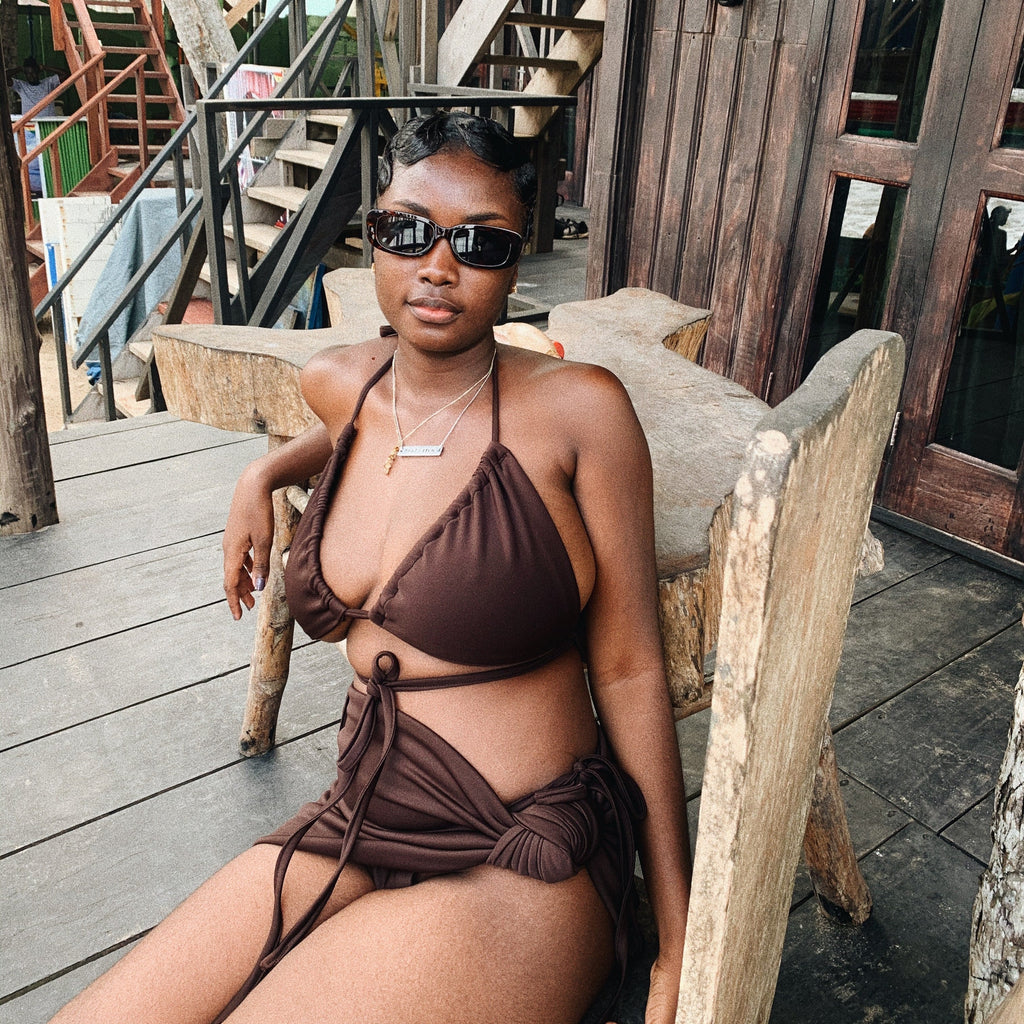 Chic dark brown bikini featuring a modern design, perfect for creating a warm, earthy look at the beach or pool.